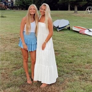 Elegant White Dress with Cream Handbag